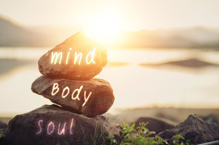 3 rocks written with mind, body and soul on them